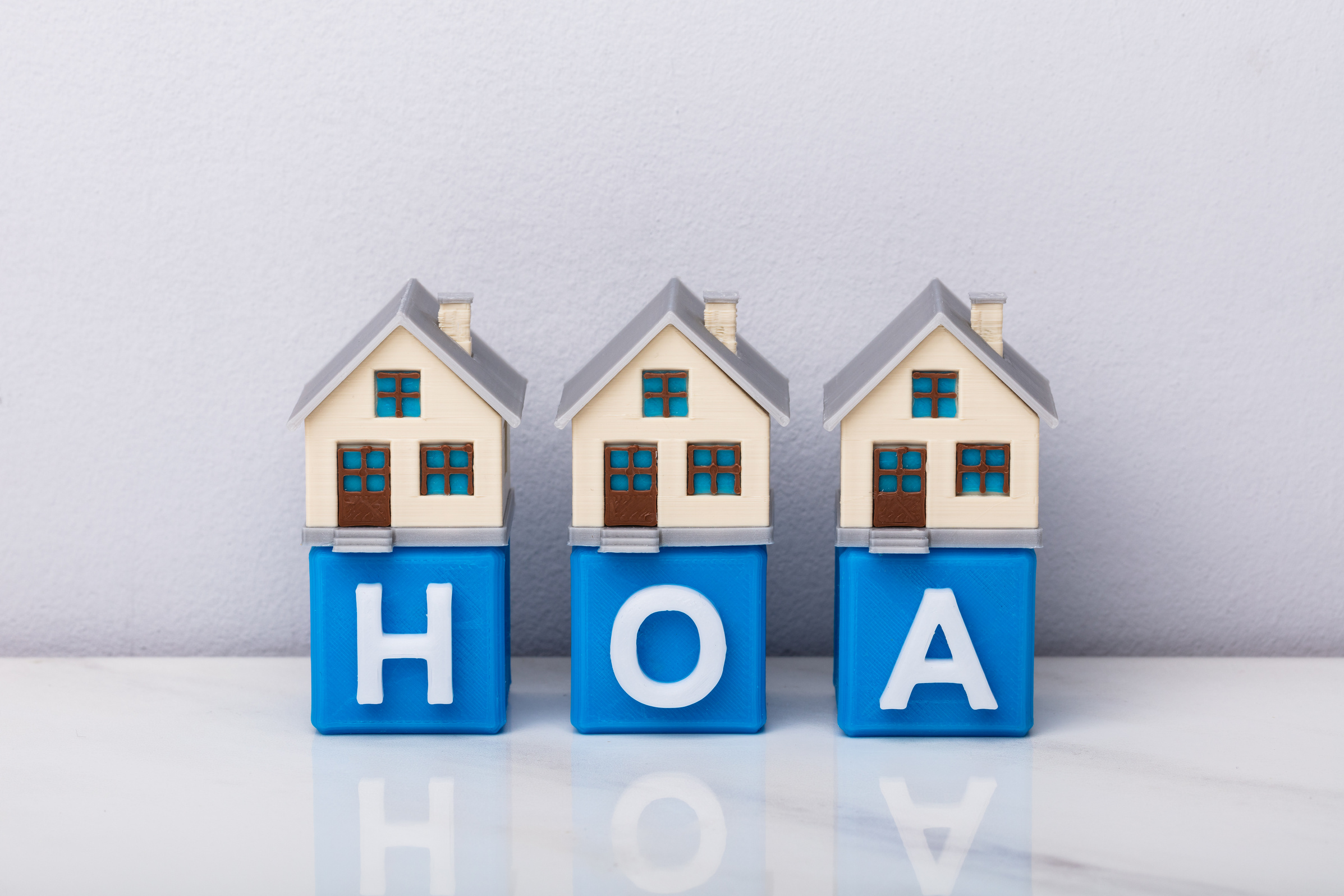 Row Of House Models On HOA Cubic Blocks